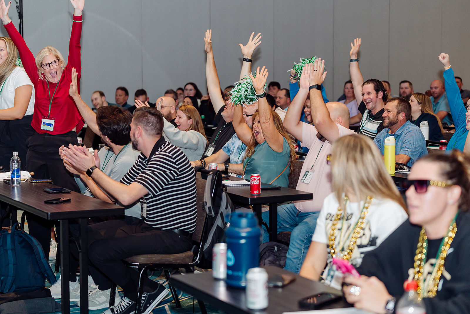 Corporate event guests respond enthusiastically during an interactive session