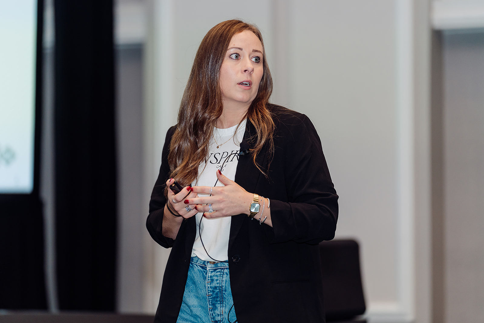 A professional leads a focused presentation for colleagues